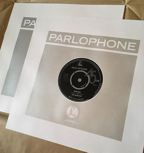 Print of Parlophone record cover with a stylized vinyl record design on a beige background